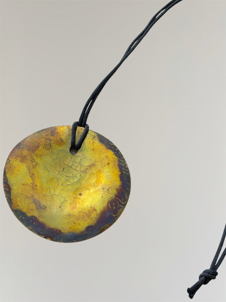 VINTAGE ROBERT LEE MORRIS DISC PENDANT